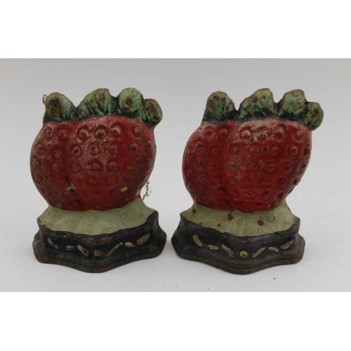 424 - A collection of ten cast and painted iron doorsteps, fruit designs include strawberries, pears, etc.... 