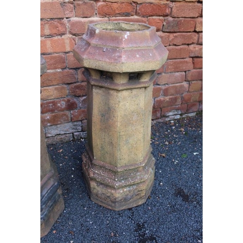 437 - A pair of stoneware chimney pots with octagonal tops, and flared stems, 75cm high