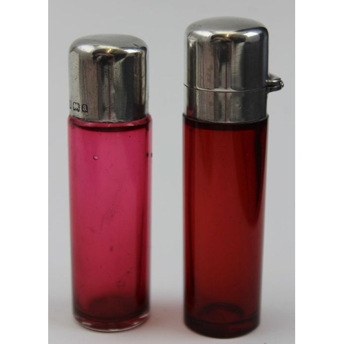 46 - Two Victorian ruby scent bottles with silver mounts, Birmingham1898-1900 tallest 7cm