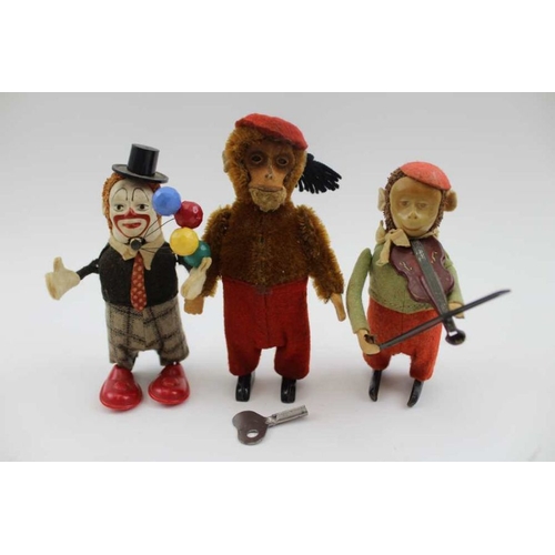 469 - A Schuco tin plate clockwork juggling Clown, 11cm high, moulded to the base 'Schuko ... made in the ... 