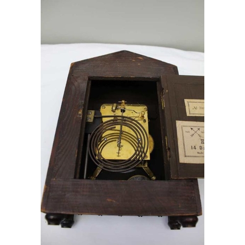 477 - A 19th century mantel clock, the mahogany case carved bamboo effect, the dial with Roman numerals, 3... 