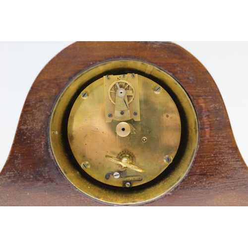 479 - An Edwardian mahogany hat clock, circular dial with Arabic numerals, 8cm in diameter, raised on bras... 