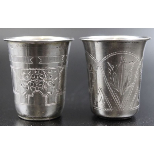 49 - Five Russian silver vodka beakers with engraved decoration, marked 84, two dated 1870-1894 combined ... 