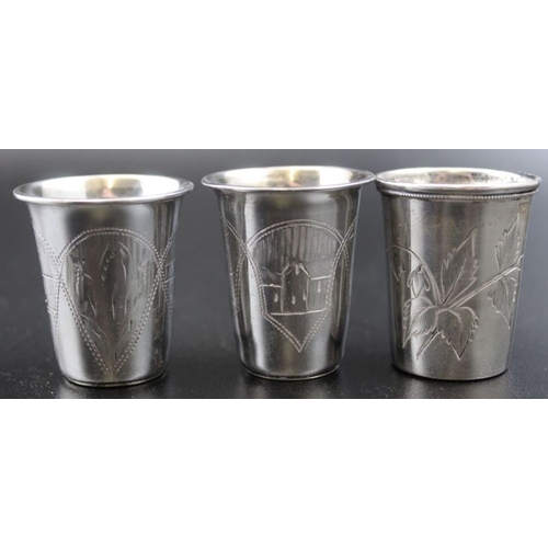 49 - Five Russian silver vodka beakers with engraved decoration, marked 84, two dated 1870-1894 combined ... 