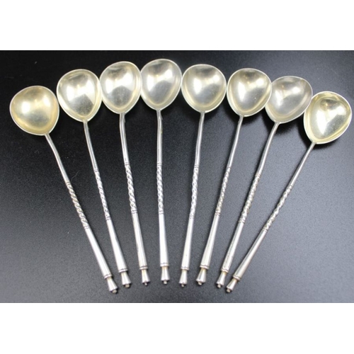 50 - A set of eight Russian silver tea stirrers, engraved bowls with monogram 