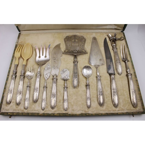 51 - A cased set of thirteen French serving pieces with silver handles, Minerva marks