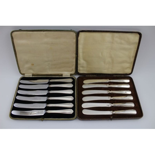 55 - Two cased silver sets of egg cups with spoons, and two cased sets of silver handled knives. silver w... 