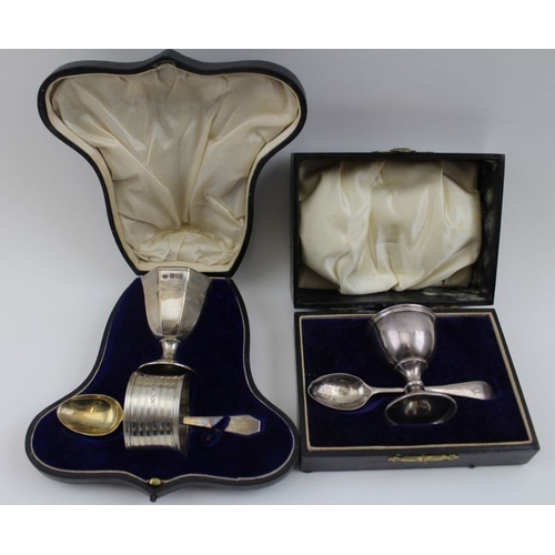 55 - Two cased silver sets of egg cups with spoons, and two cased sets of silver handled knives. silver w... 