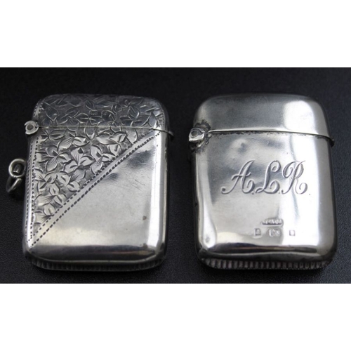 56 - A silver shaving container Birmingham 1920 with original bar of soap, two silver vesta cases, a silv... 