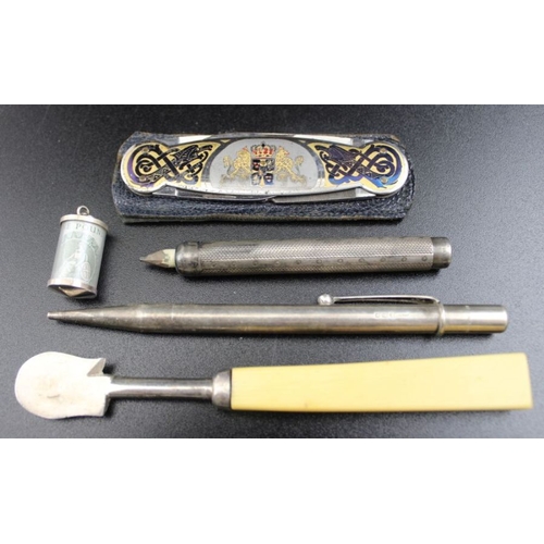 60 - Two Victorian cased silver mounted cigarette holders, together with two silver pencils, cigar cutter... 