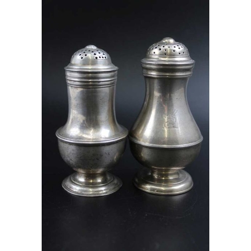 67 - A George II silver pepper of baluster form, London 1735, 9cm high, together one other Georgian silve... 