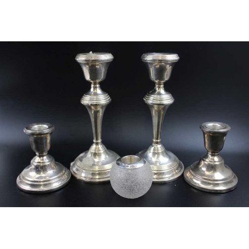 68 - Broadway & Co. A pair of silver candlesticks, with ring turned decoration, 17cm high, Birmingham 196... 