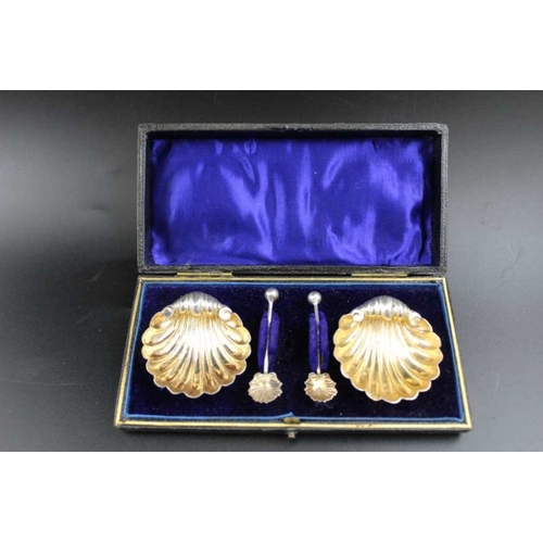 70 - William Henry Leather, a pair of Edwardian silver scallop form salts, with gilded interiors, matchin... 