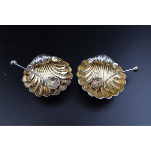 70 - William Henry Leather, a pair of Edwardian silver scallop form salts, with gilded interiors, matchin... 