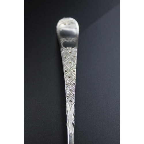 71 - A George III silver berry embossed sugar sifting ladle, gilded internal bowl, London 1800, 41g