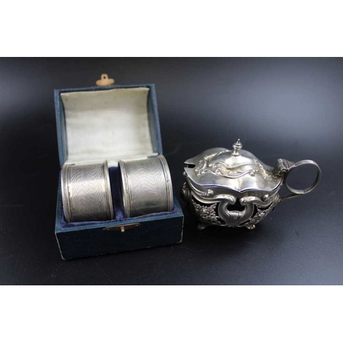 73 - Robert Pringle & Sons, a silver mustard pot, with hinged cover, richly embossed decoration, Chester ... 