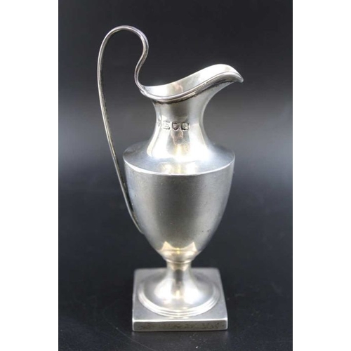 78 - Haseler Brothers, A Georgian design silver cream jug of ewer form, on square base, London 1900, 88g,... 