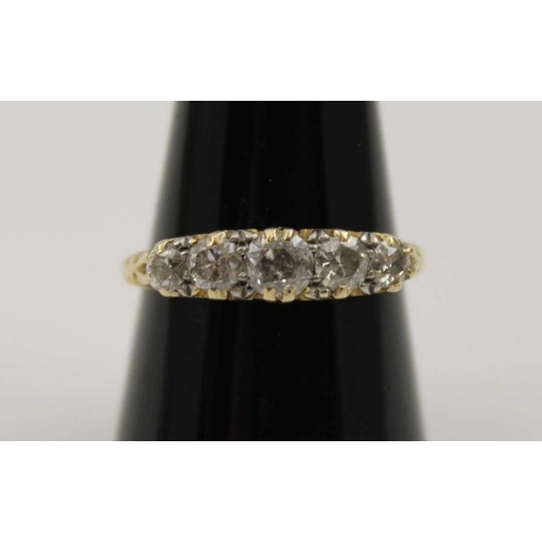 81 - An 18ct gold ring set five graduated brilliant cut diamonds, gross weight: 3.6g, ring size: Q