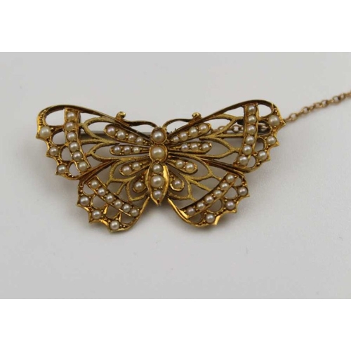 83 - A 15ct gold butterfly design brooch, inset seed pearls, 4cm, gross weight: 5.4g, fitted with safety ... 