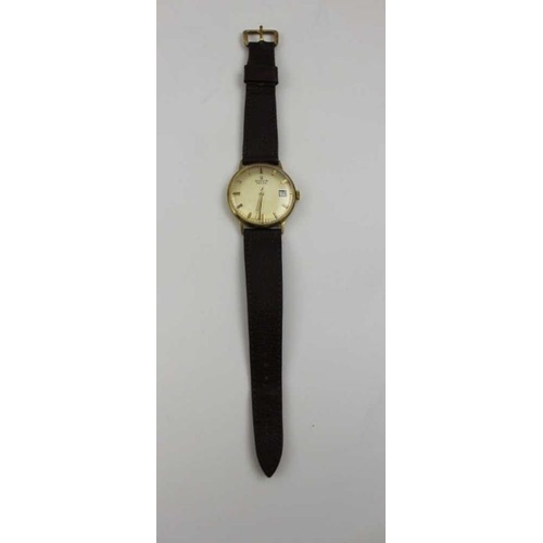 87 - A Marvin Revue gents 9ct gold cased wristwatch, baton dial, with date aperture, and leather strap