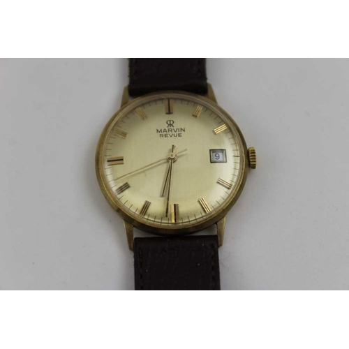 87 - A Marvin Revue gents 9ct gold cased wristwatch, baton dial, with date aperture, and leather strap