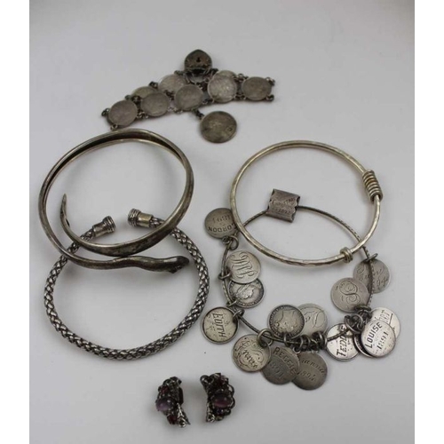 93 - A collection of silver and white metal Art jewellery, includes; a silver boss brooch, inset malachit... 