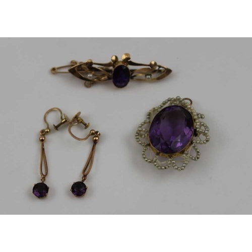 96 - A 15ct gold brooch inset amethyst coloured stone, a pair of drop earrings, pendant with a seed pearl... 