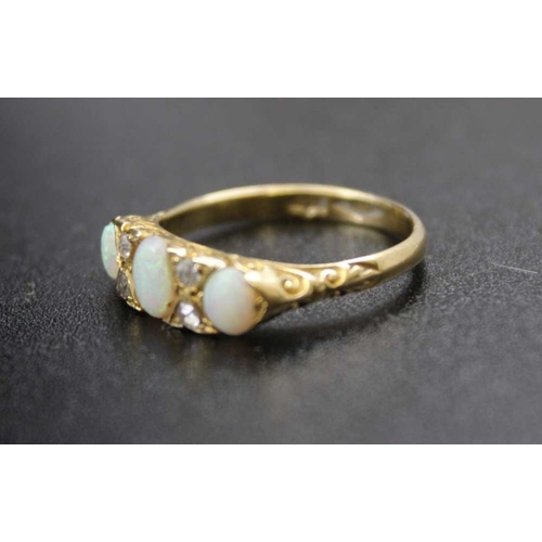 98 - An 18CT gold opal and diamond set ring Q.5 size