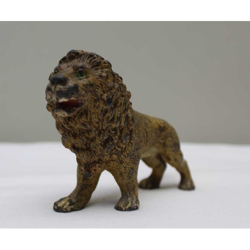 138 - A 19th century cast & painted spelter lion and lioness, he stands 8cm high