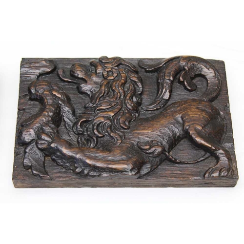 122 - A pair of 18th century carved oak panels, with lion decoration, 13cm x 20cm