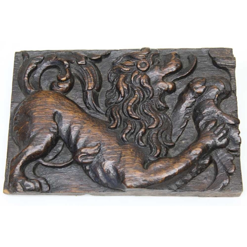 122 - A pair of 18th century carved oak panels, with lion decoration, 13cm x 20cm