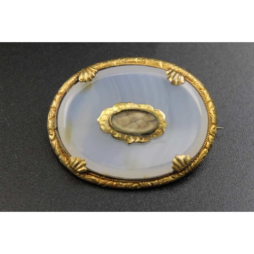 207 - A Victorian cameo brooch 6 x5 cm together with an oval Victorian broach with memento mori hair panel... 