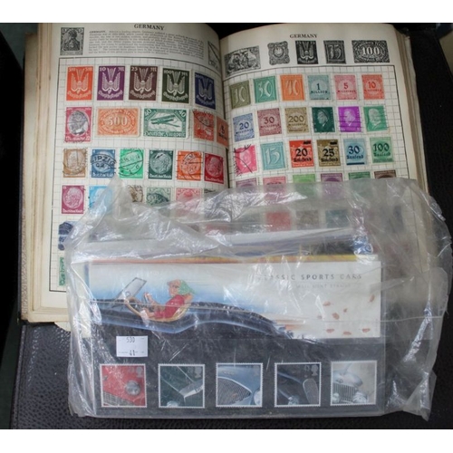 101 - The Wanderer Stamp Album containing a World collection in old album, together with some postcards va... 