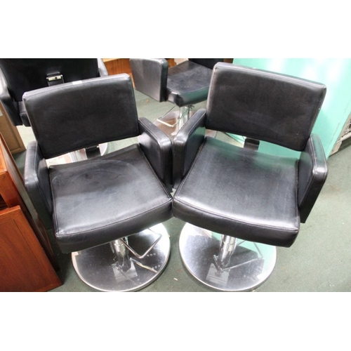 104 - A pair of leatherette Barbers chairs on chromed bases