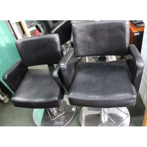 105 - A pair of leatherette Barbers chairs on chromed bases