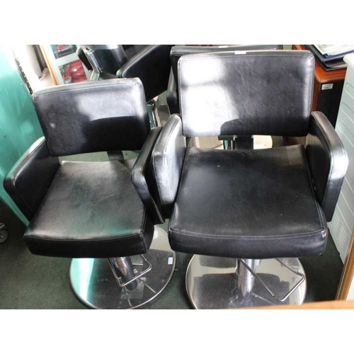 105 - A pair of leatherette Barbers chairs on chromed bases