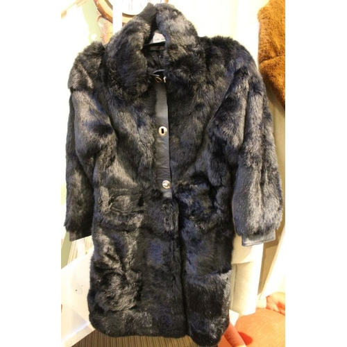 167 - A fur coat, with leather trim, size 10