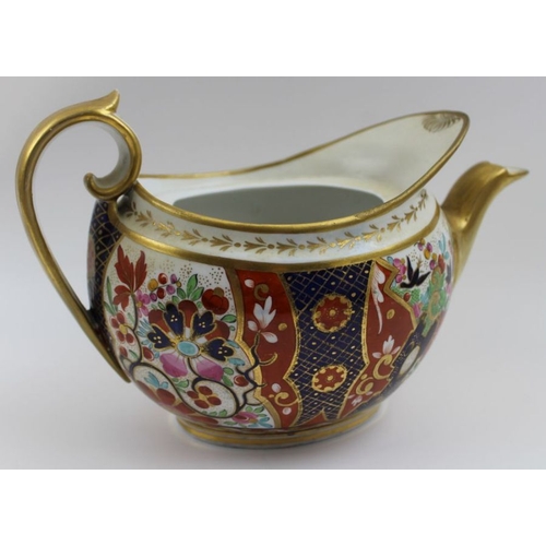 183 - An early 19th century porcelain teapot, with hand painted and gilded Japan decoration