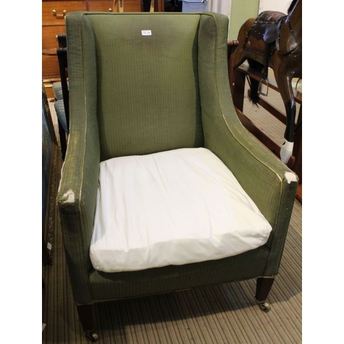 207 - An Edwardian upholstered deep seated ridged framed armchair