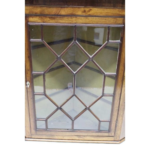 210 - A 19th century mahogany hanging corner cupboard, with fancy bar glaze single door, and glass shelved... 