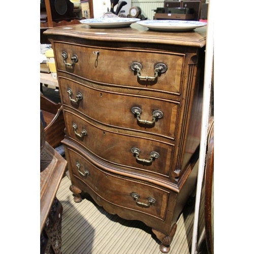 230 - A good quality reproduction serpentine fronted four drawer chest on short cabriole legs with shell c... 