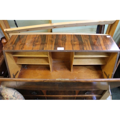 34 - A fancy veneered bureau unit with flower head handles