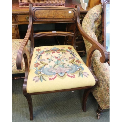 38 - A Regency mahogany reeded armchair with needlework drop in seatpad over sabre legs