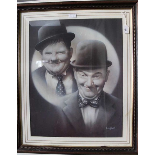 406 - A large framed poster print of Laurel & Hardy with signature, S Coffield