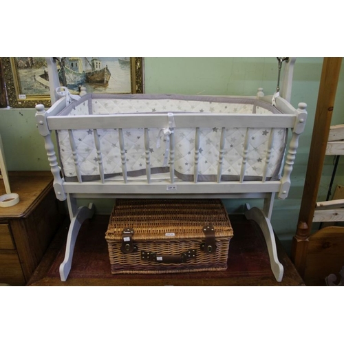 42 - A white painted rocking wooden crib