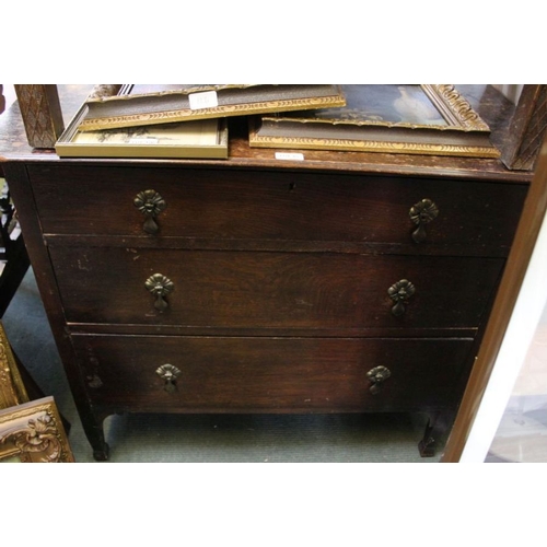 65 - An oak three drawer chest