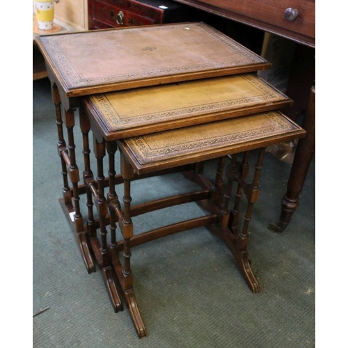 76 - Nest of three tables with leather tops