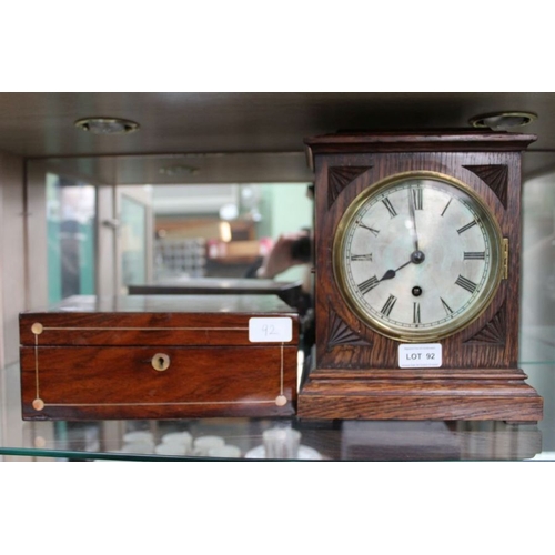 92 - An Edwardian oak mantel clock, together with a Rosewood jewellery box