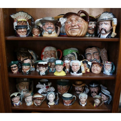 11 - A large collection of Royal Doulton character jugs.