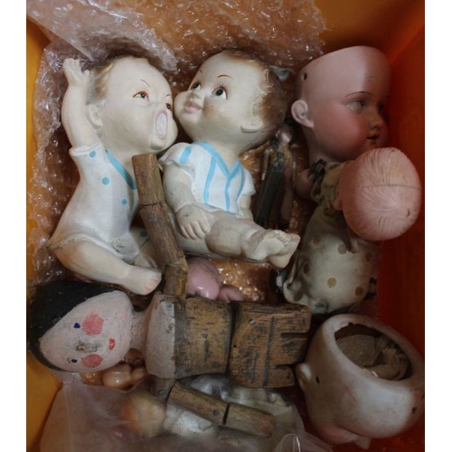 13 - A box of doll parts